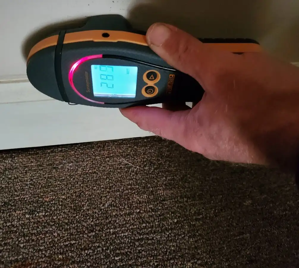 Moisture detection at baseboard during Burst Pipe Cleanup in Coffeyville